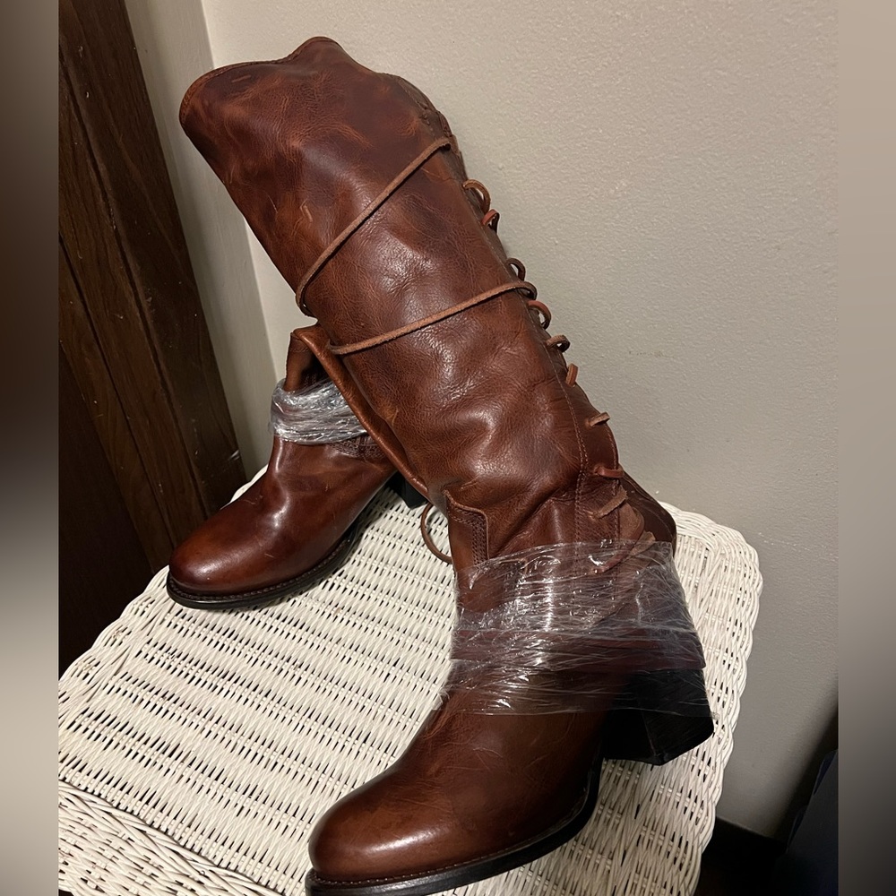 Brand new, never worn handmade Freebird leather lace up knee high boots. 8.5